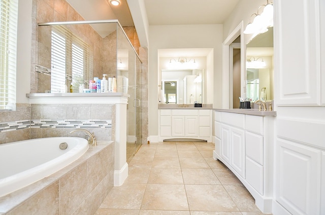27522 Blackstone Canyon Ln, Katy, TX 77494 - bathroom with vanity, a garden tub, a stall shower, and tile patterned flooring
