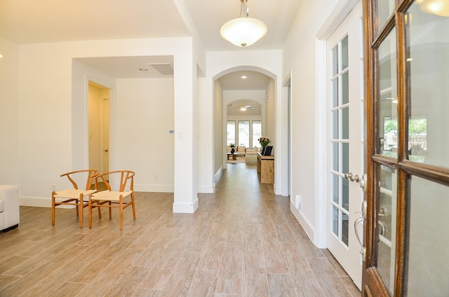 27522 Blackstone Canyon Ln, Katy, TX 77494 - entryway with french doors, arched walkways, and light wood-style floors