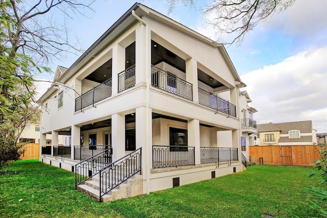 8304 Maple Ct, Bellaire, TX 77401 - back of property featuring stucco siding and a balcony
