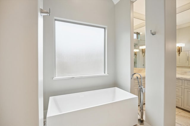8304 Maple Ct, Bellaire, TX 77401 - bathroom featuring a freestanding bath and vanity