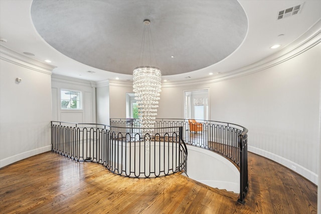 8304 Maple Ct, Bellaire, TX 77401 - corridor featuring an upstairs landing, a chandelier, ornamental molding, hardwood / wood-style floors, and recessed lighting