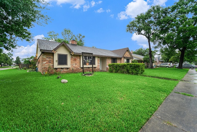 14030 Duncannon Dr, Houston, TX 77015 - ranch-style house featuring brick siding, a front yard, a chimney, and a shingled roof