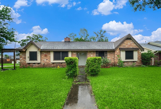 14030 Duncannon Dr, Houston, TX 77015 - ranch-style home with brick siding, roof with shingles, and a front lawn