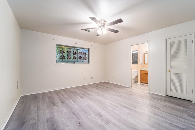 14030 Duncannon Dr, Houston, TX 77015 - unfurnished bedroom featuring light wood-style flooring, ensuite bath, and a ceiling fan
