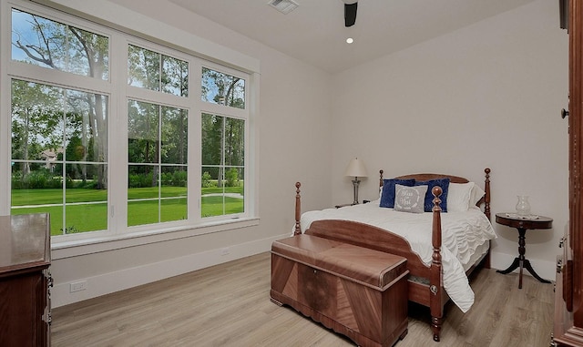 27003 Hidden Grove Landing Dr, Spring, TX 77386 - bedroom featuring light wood finished floors and a ceiling fan