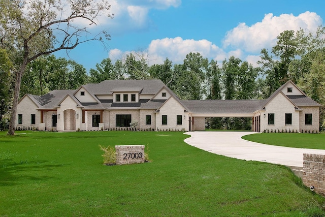 27003 Hidden Grove Landing Dr, Spring, TX 77386 - view of front of property with driveway, brick siding, a front lawn, and an attached carport