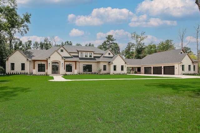 27003 Hidden Grove Landing Dr, Spring, TX 77386 - rear view of house featuring a garage, brick siding, and a yard