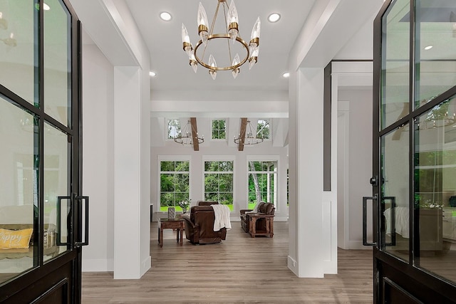 27003 Hidden Grove Landing Dr, Spring, TX 77386 - foyer entrance with a chandelier, light wood-style flooring, and recessed lighting