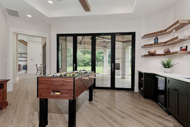 27003 Hidden Grove Landing Dr, Spring, TX 77386 - rec room with light wood-style flooring, french doors, recessed lighting, and beverage cooler