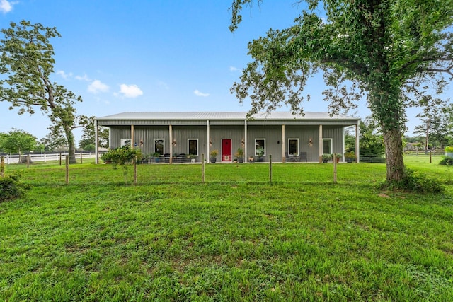 43 Windmill Dr, Hempstead, TX 77445 - back of property featuring an outbuilding and a metal roof