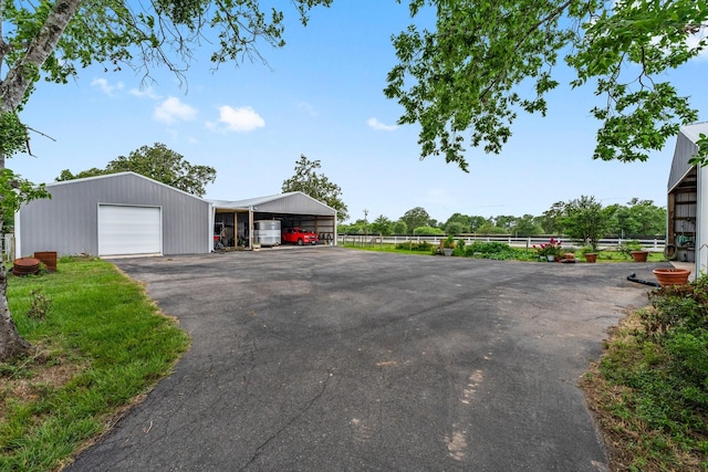 43 Windmill Dr, Hempstead, TX 77445 - view of asphalt driveway featuring an outbuilding
