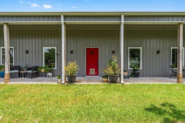 43 Windmill Dr, Hempstead, TX 77445 - property entrance with a lawn and a patio area