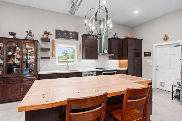 43 Windmill Dr, Hempstead, TX 77445 - kitchen with tasteful backsplash, dark brown cabinetry, appliances with stainless steel finishes, a chandelier, and hanging light fixtures