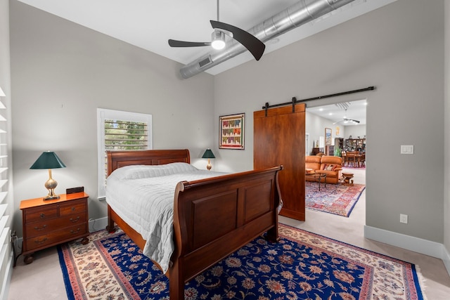43 Windmill Dr, Hempstead, TX 77445 - bedroom with a barn door and ceiling fan