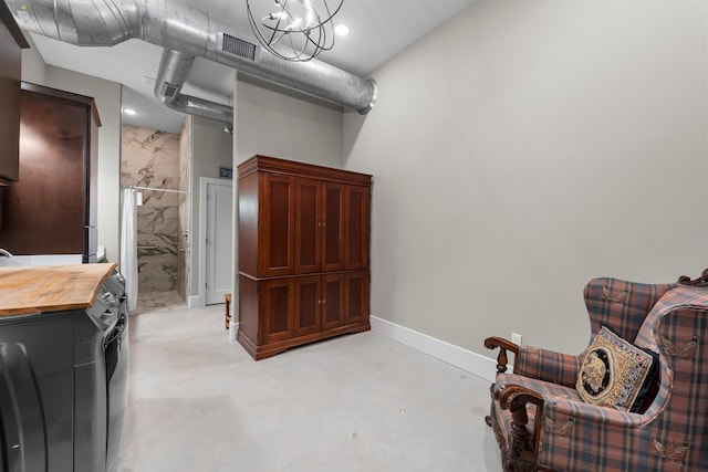 43 Windmill Dr, Hempstead, TX 77445 - sitting room featuring concrete floors and a chandelier