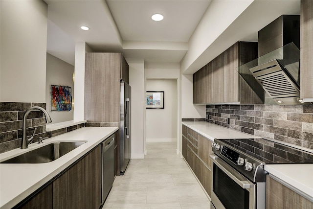 14 Greenway Plz Unit 15Q, Houston, TX 77046 - kitchen featuring stainless steel appliances, modern cabinets, wall chimney range hood, light countertops, and recessed lighting