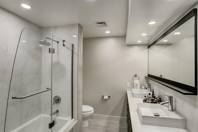 14 Greenway Plz Unit 15Q, Houston, TX 77046 - bathroom featuring recessed lighting, double vanity, and shower / tub combination