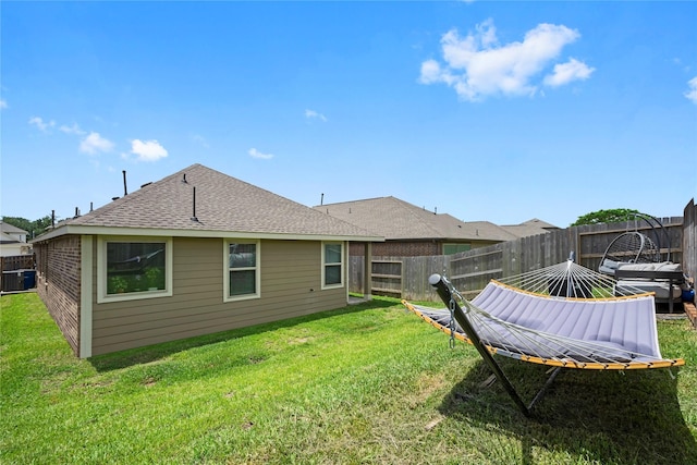 6213 Arcadia Sound Ln, Houston, TX 77365 - rear view of house with a fenced backyard and a shingled roof