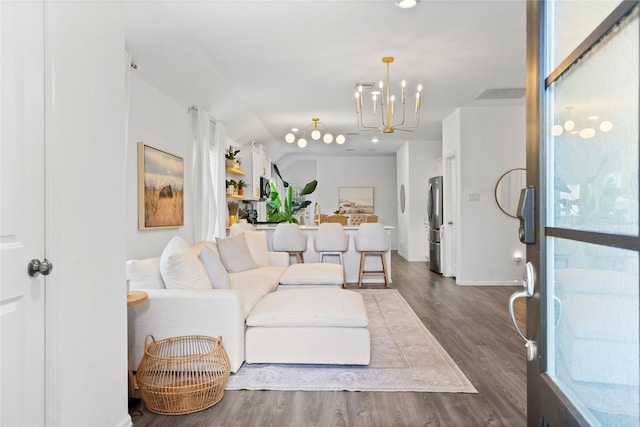 6213 Arcadia Sound Ln, Houston, TX 77365 - living room featuring a chandelier and dark wood-style flooring