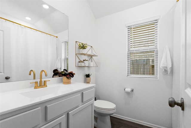 6213 Arcadia Sound Ln, Houston, TX 77365 - bathroom with vanity, healthy amount of natural light, wood finished floors, lofted ceiling, and recessed lighting
