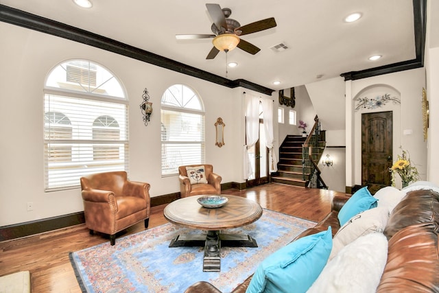 1241 W 24th St Unit B, Houston, TX 77008 - living room with crown molding, stairs, plenty of natural light, wood finished floors, and a ceiling fan