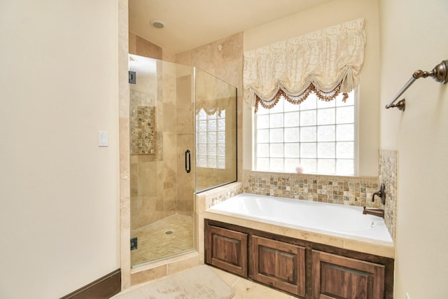 1241 W 24th St Unit B, Houston, TX 77008 - bathroom featuring a bath, a stall shower, and tile patterned floors