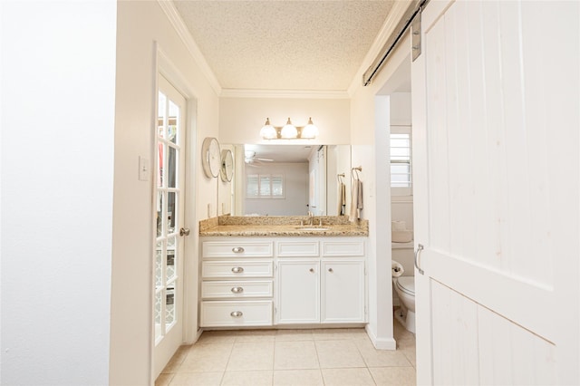 2026 Briar Ridge Dr, Rosenberg, TX 77471 - bathroom with a textured ceiling, tile patterned floors, vanity, ornamental molding, and a ceiling fan