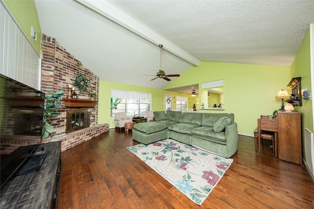 2026 Briar Ridge Dr, Rosenberg, TX 77471 - living area featuring a brick fireplace, hardwood / wood-style floors, ceiling fan, and a textured ceiling