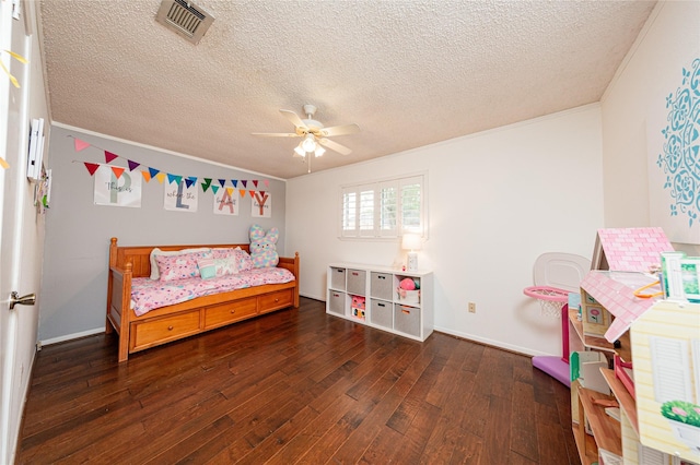 2026 Briar Ridge Dr, Rosenberg, TX 77471 - bedroom featuring ornamental molding, wood-type flooring, a textured ceiling, and ceiling fan