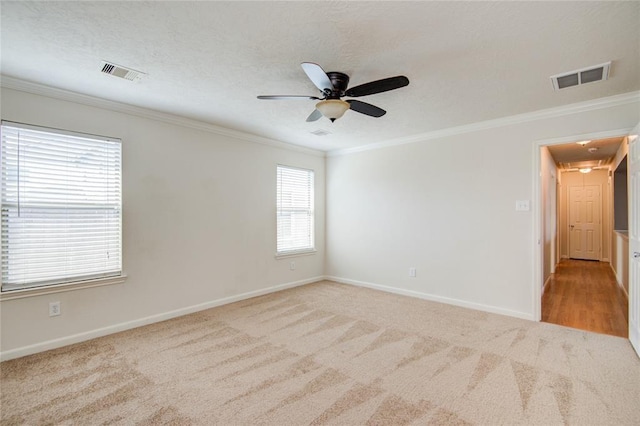 2666 Skyview Knoll Ct, Houston, TX 77047 - empty room featuring attic access, ornamental molding, light carpet, and a ceiling fan