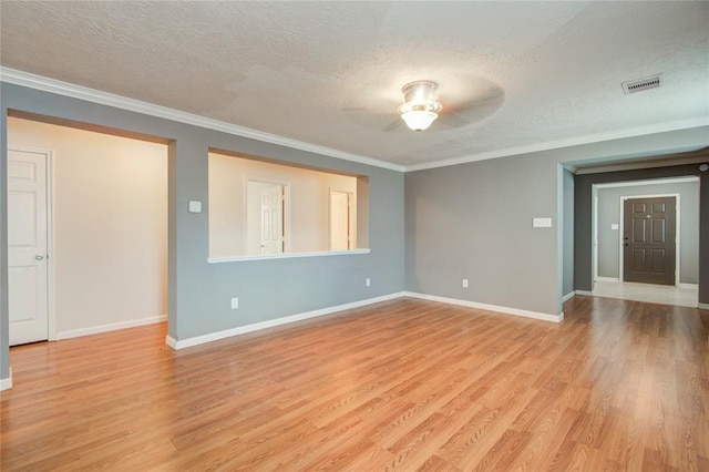2666 Skyview Knoll Ct, Houston, TX 77047 - spare room featuring ceiling fan, a textured ceiling, light wood-type flooring, and crown molding