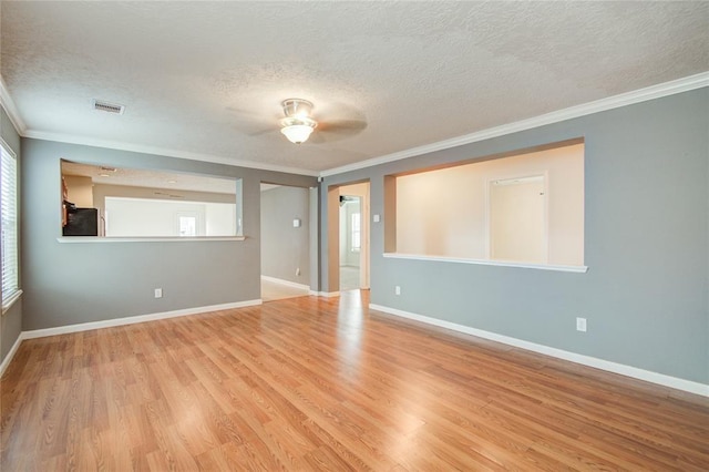 2666 Skyview Knoll Ct, Houston, TX 77047 - unfurnished room featuring ornamental molding, a textured ceiling, plenty of natural light, wood finished floors, and a ceiling fan