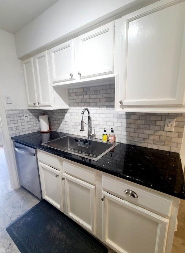 7447 Cambridge St Unit 8, Houston, TX 77054 - kitchen featuring stainless steel dishwasher, white cabinets, tasteful backsplash, and light marble finish flooring