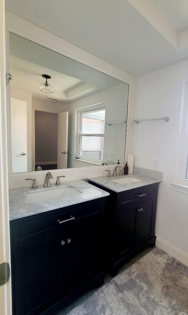 7447 Cambridge St Unit 8, Houston, TX 77054 - bathroom with vanity and baseboards
