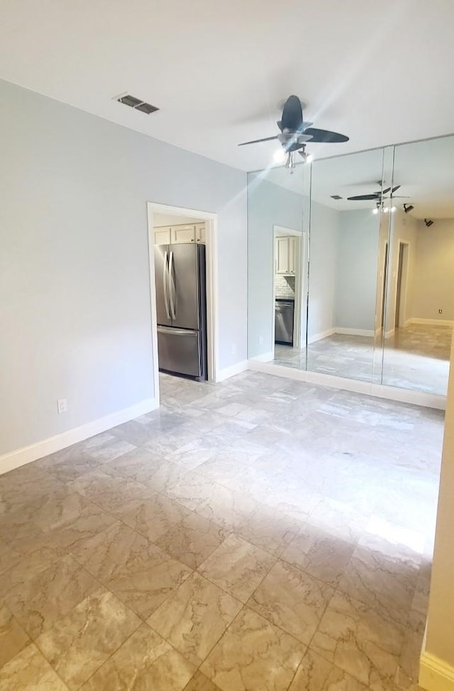 7447 Cambridge St Unit 8, Houston, TX 77054 - unfurnished bedroom with freestanding refrigerator and ceiling fan