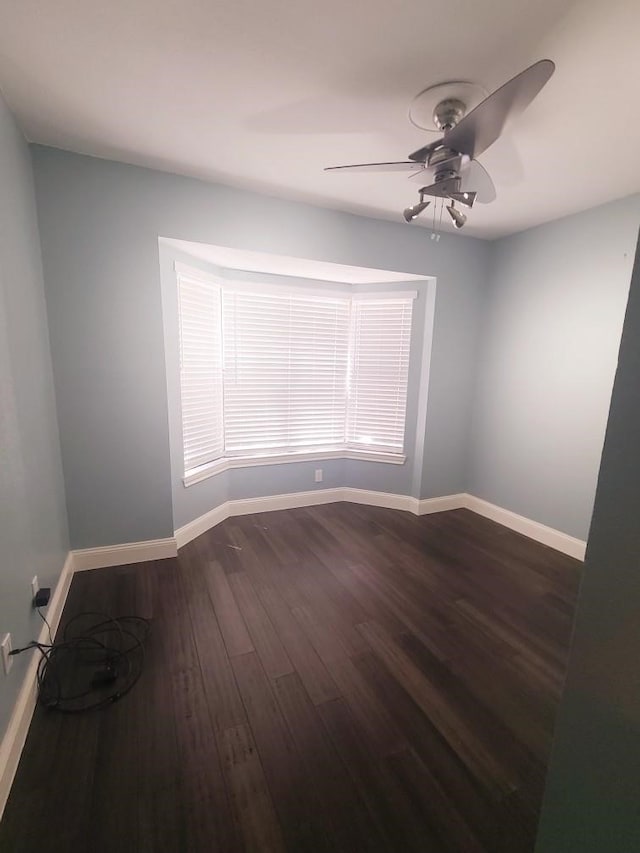 7447 Cambridge St Unit 8, Houston, TX 77054 - spare room with dark wood-type flooring and a ceiling fan