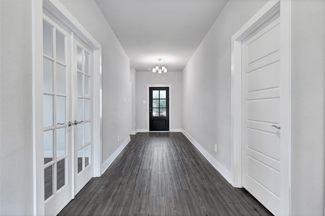 10329 S Goshawk Trl, Conroe, TX 77385 - doorway featuring a chandelier and dark wood finished floors