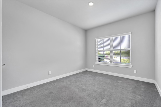 10329 S Goshawk Trl, Conroe, TX 77385 - spare room with dark colored carpet and recessed lighting