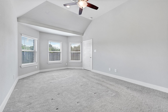 10329 S Goshawk Trl, Conroe, TX 77385 - empty room with ceiling fan, light colored carpet, and lofted ceiling