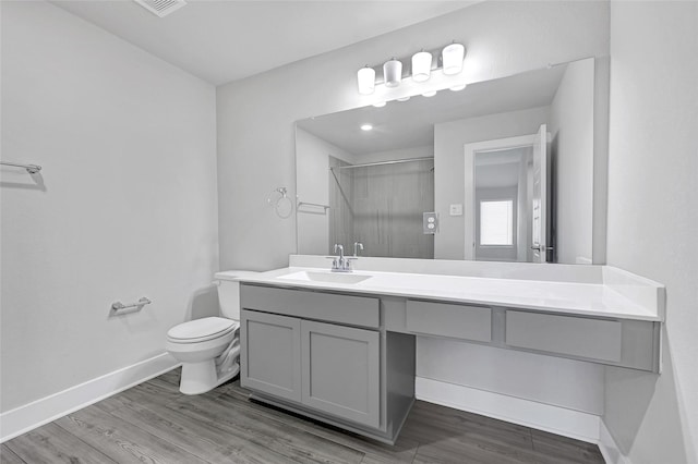 10329 S Goshawk Trl, Conroe, TX 77385 - bathroom featuring vanity, a shower with door, and wood finished floors