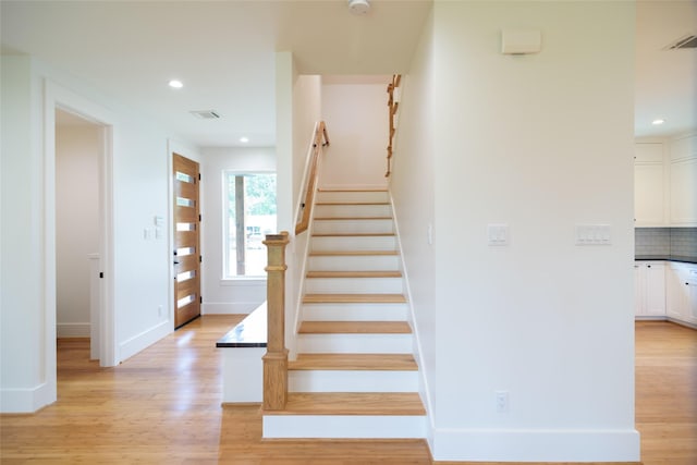 1037 Rutland St, Houston, TX 77008 - stairs with wood finished floors and recessed lighting
