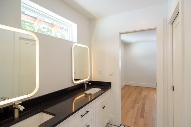 1037 Rutland St, Houston, TX 77008 - bathroom with double vanity and wood finished floors