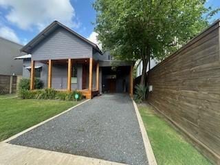 1037 Rutland St, Houston, TX 77008 - view of front of home with driveway and a front lawn
