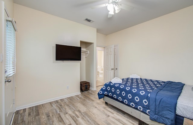16713 Kingston Way, Jamaica Beach, TX 77554 - bedroom with wood finished floors and a ceiling fan