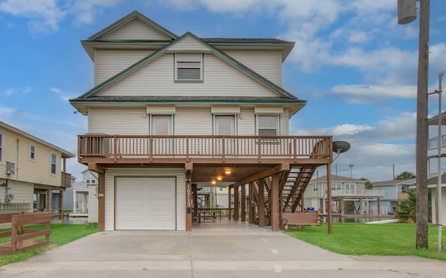 16713 Kingston Way, Jamaica Beach, TX 77554 - coastal home with a carport, a garage, a front lawn, concrete driveway, and stairway