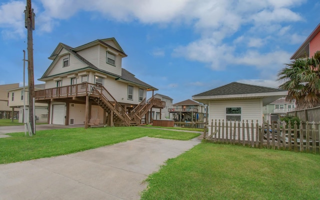 16713 Kingston Way, Jamaica Beach, TX 77554 - view of yard with stairway, a wooden deck, and a garage