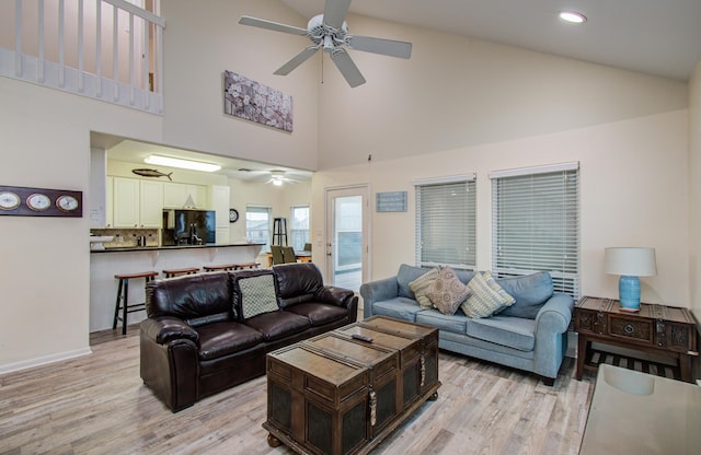 16713 Kingston Way, Jamaica Beach, TX 77554 - living room with ceiling fan, high vaulted ceiling, light wood finished floors, and recessed lighting