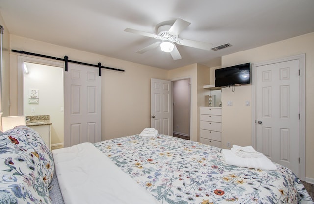 16713 Kingston Way, Jamaica Beach, TX 77554 - bedroom featuring a barn door and a ceiling fan