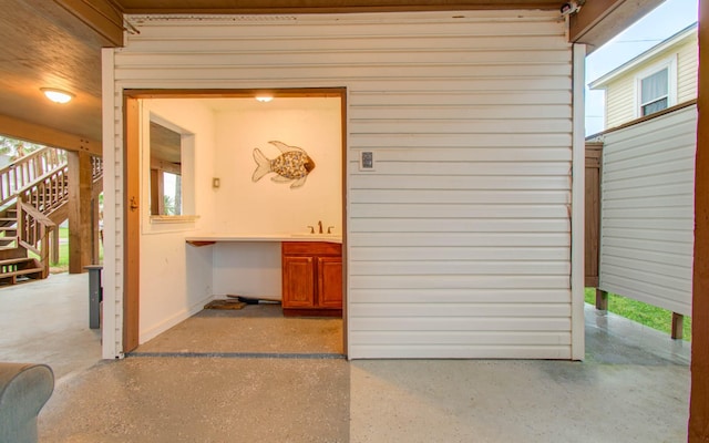 16713 Kingston Way, Jamaica Beach, TX 77554 - view of exterior entry featuring a sink and a patio