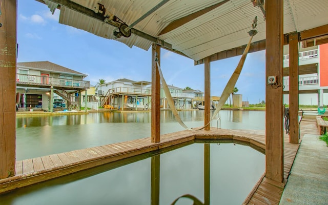 16713 Kingston Way, Jamaica Beach, TX 77554 - water view with nearby suburban area and a boat dock